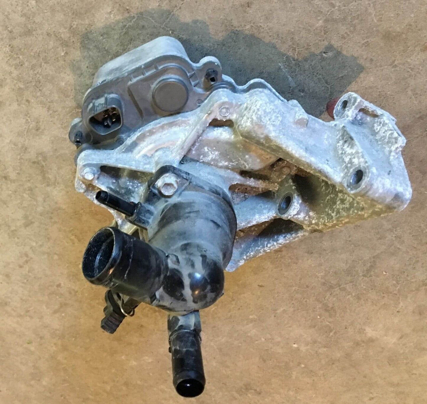 2012-2014 Toyota Prius C 1.5L Water Pump W/ Coolant Thermostat Housing used OEM part in excellent condition