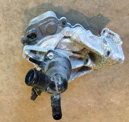 2012-2014 Toyota Prius C 1.5L Water Pump W/ Coolant Thermostat Housing used OEM part in excellent condition
