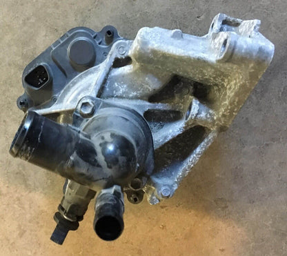 2012-2014 Toyota Prius C 1.5L Water Pump W/ Coolant Thermostat Housing, used OEM part in excellent condition at GreenGears Auto.