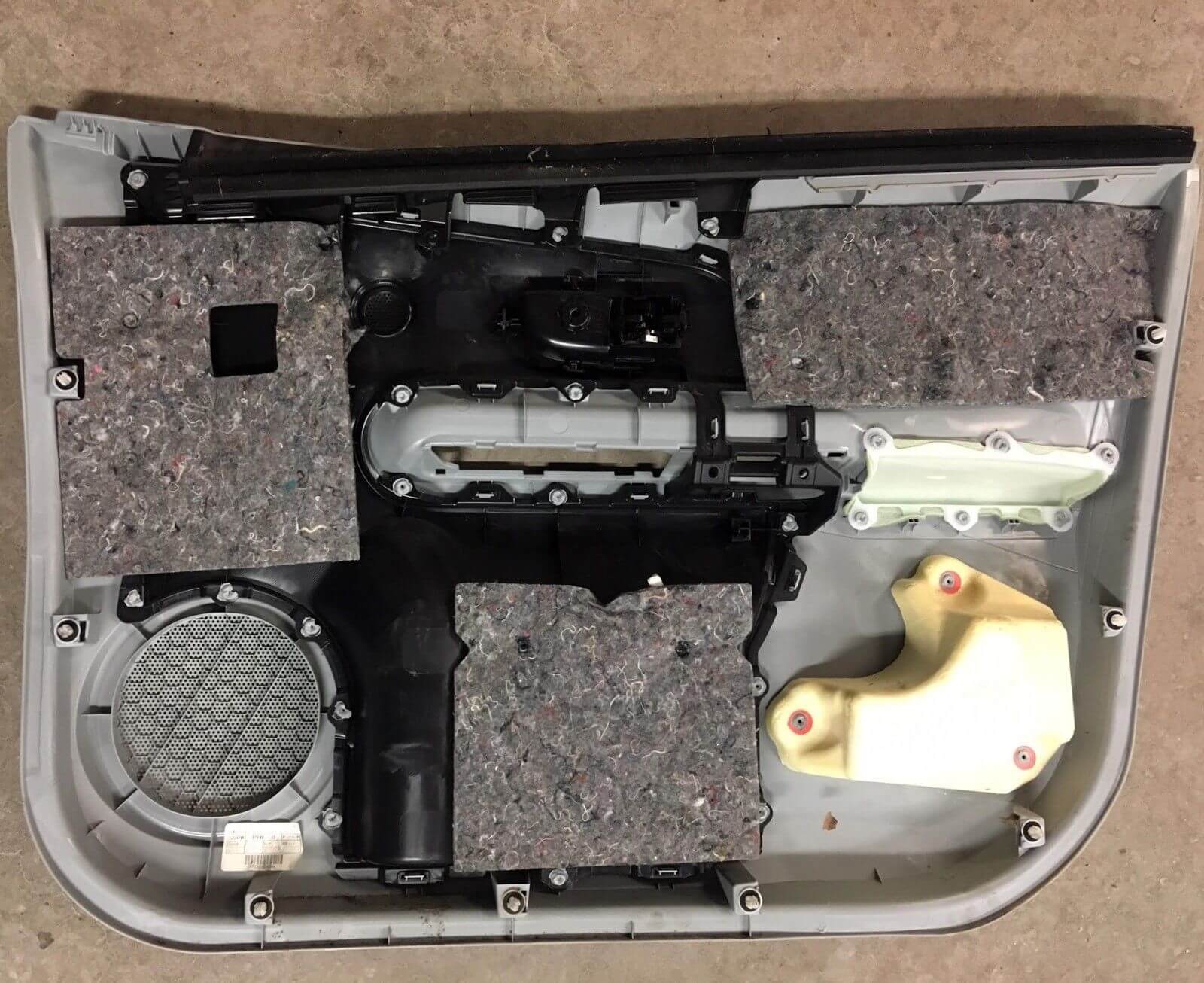 2012-2017 Toyota Prius C Front Door Trim Panel Left Driver - used OEM part, interior view showing components and design features.