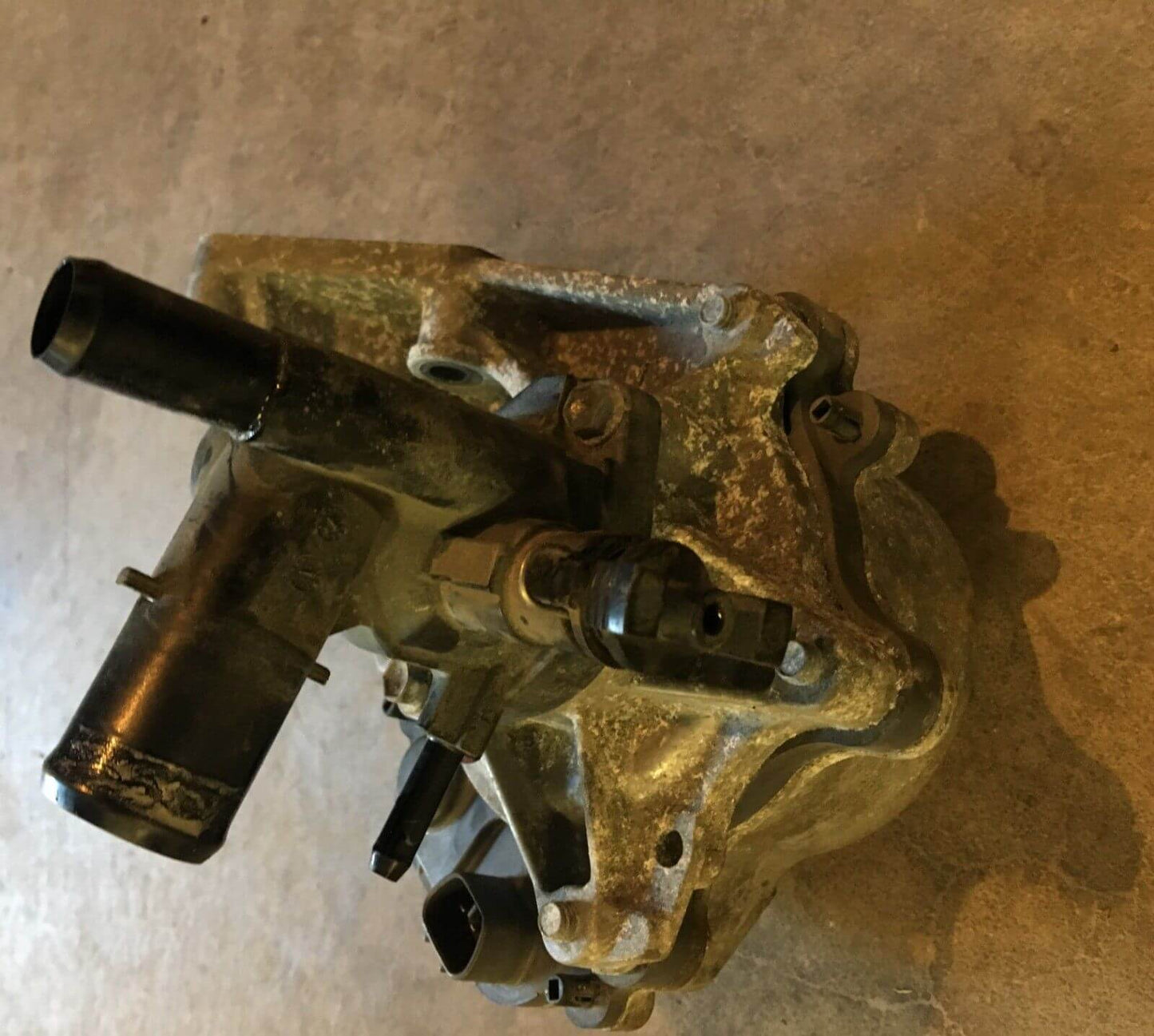 2012-2014 Toyota Prius C 1.5L Water Pump W/ Coolant Thermostat Housing, used OEM part, excellent condition from GreenGears Auto