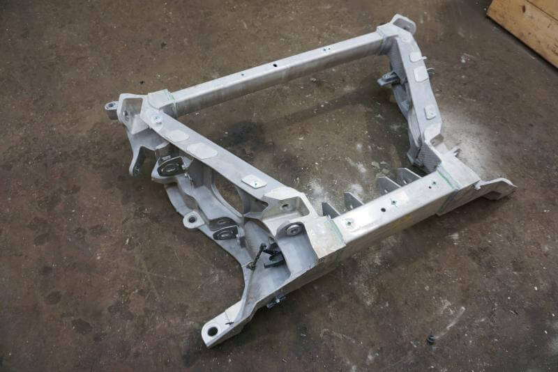 2022 - 2023 Rivian R1T Rear Subframe Crossmember K Frame used OEM part on workshop floor