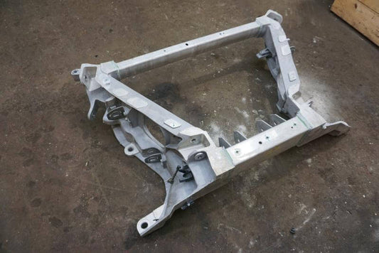 2022 - 2023 Rivian R1T Rear Subframe Crossmember K Frame used OEM part on workshop floor